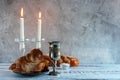 Shabbat Shalom - challah bread, shabbat wine and candles on wooden table Royalty Free Stock Photo