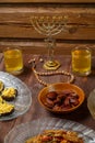Shabbat table with traditional holiday food meat sweets wine menorah