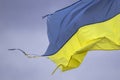 The shabby blue-yellow flag of Ukraine as a symbol of the nation`s struggle and courage