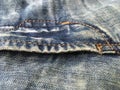 Shabby boiled denim accessories in blue close. Royalty Free Stock Photo