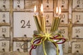 Shabby chic advents calendar with four gold burning candles