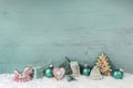 Shabby chic christmas decoration in turquoise on wooden background. Royalty Free Stock Photo