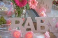 Shabby Chic pink baby shower decorations on table