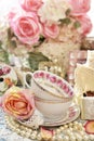Shabby chic style decorations with tea cups, roses and laces Royalty Free Stock Photo