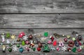 Shabby chic wooden grey christmas background with colored miniatures as decoration.