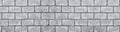 Shabby grey concrete brick block wall wide texture. Large grungy background