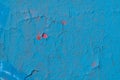 Old weathered wall with red color under blue one