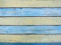 Shabby painted wooden texture, background and wallpaper - blue and yellow. Close up of wall made of wood planks Royalty Free Stock Photo