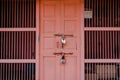 Shabby pink wooden door with two old latches on, in Mandawa haveli in Rajasthan India Royalty Free Stock Photo