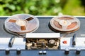 Shabby reel-to-reel recorder outdoors Royalty Free Stock Photo