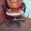 Shabby retro leather chair, concept of business problems