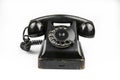 Shabby retro phone of black color isolated on a white background