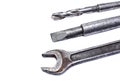Shabby spanner, chisel and drill on white background Royalty Free Stock Photo