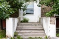 Shabby stone porch and closed door of city house