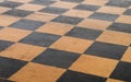 shabby surface of an old wooden chessboard
