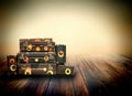 Shabby Vintage Ancient Suitcases. Background of wooden boards. Royalty Free Stock Photo