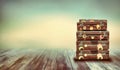 Shabby Vintage Ancient Suitcases. Background of wooden boards. Royalty Free Stock Photo