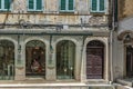 shabby walls and hanging electrical cables are typical of the greek capital of corfu