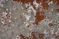 Shabby weathered grey concrete wall surface with marks of red paint texture macro