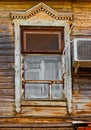 Shabby window of old wooden house with one-piece air cooling system installed Royalty Free Stock Photo