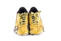 Shabby yellow futsal sports shoes on white background football sportware object isolated