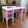 A shabbychic magenta painted writing desk with a distressed white finish. Trendy color of 2023 Viva Magenta.. AI Royalty Free Stock Photo