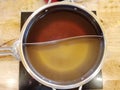 Shabu soup in the shaba pot consists of black water soup and clear soup base, divided in half. Used to boil meat and vegetables