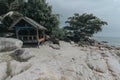 A shack on the beach with beautiful rocks and shady trees for tourism campaigns, vacation spots and design needs Royalty Free Stock Photo