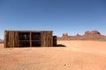 Shack in the desert with mesa and butte in the background Royalty Free Stock Photo