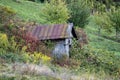 Shack with rusty roof in wildernes Royalty Free Stock Photo