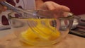 Shacking an eggs in a bowl with wisk hand mixer slow motion