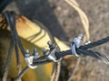 Shackles attached to wire cables and safety net