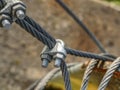 Shackles attached to wire cables and safety net