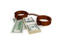 Shackles and dollar pack. Royalty Free Stock Photo