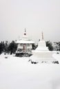 Shad Tchup Ling Buddhist monastery in winter. Stupa and pagoda on top of Kachkanar mountain, Ural, Russia