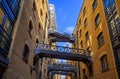 Shad Thames in London, UK. Historic Shad Thames is an old cobbled street known for its restored overhead bridges and walkways Royalty Free Stock Photo