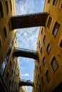 Shad Thames in London, UK. Historic Shad Thames is an old cobbled street known for it`s restored overhead bridges and walkways Royalty Free Stock Photo