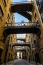 Shad Thames in London, UK. Historic Shad Thames is an old cobbled street known for it`s restored overhead bridges and walkways