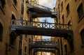 Shad Thames in London, UK. Historic Shad Thames is an old cobbled street known for it`s restored overhead bridges and walkways Royalty Free Stock Photo