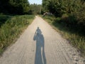 Shade of a biker on the road Royalty Free Stock Photo