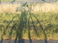 Shade of a biker on the road Royalty Free Stock Photo