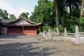 Shaded flagstone paved yard before ancient building in sunny aft Royalty Free Stock Photo