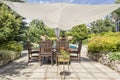 Shaded garden corner providing rest from summer heat Royalty Free Stock Photo