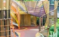 Shaded kid`s playground activity tower equipment at park. Children`s playing area indoor with toys equipment. Royalty Free Stock Photo