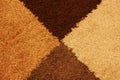 Four shades of brown wool textile texture background made from triangles