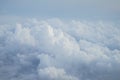 Shades of light blue color sky and fluffy soft white cloud view from airplane window Royalty Free Stock Photo