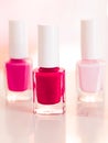 Shades of pink and red nail polish set on glamour background, nailpolish bottles for manicure and pedicure, luxury