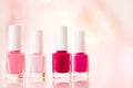 Shades of pink and red nail polish set on glamour background, nailpolish bottles for manicure and pedicure, luxury