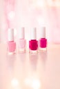 Shades of pink and red nail polish set on glamour background, nailpolish bottles for manicure and pedicure, luxury