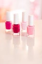 Shades of pink and red nail polish set on glamour background, nailpolish bottles for manicure and pedicure, luxury